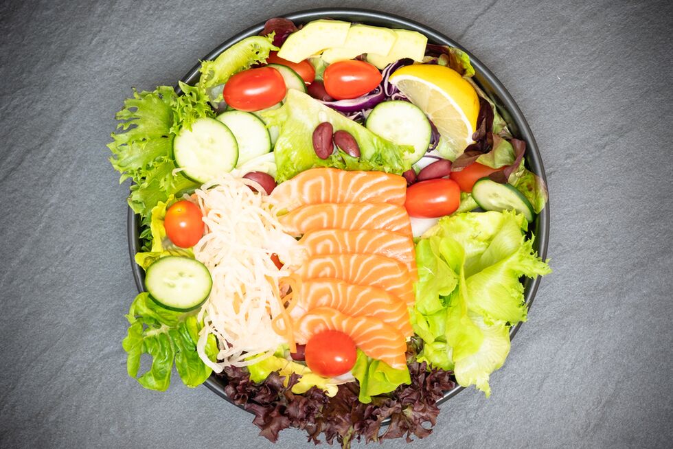 Delicious salmon salad in the menu of proper nutrition for weight loss